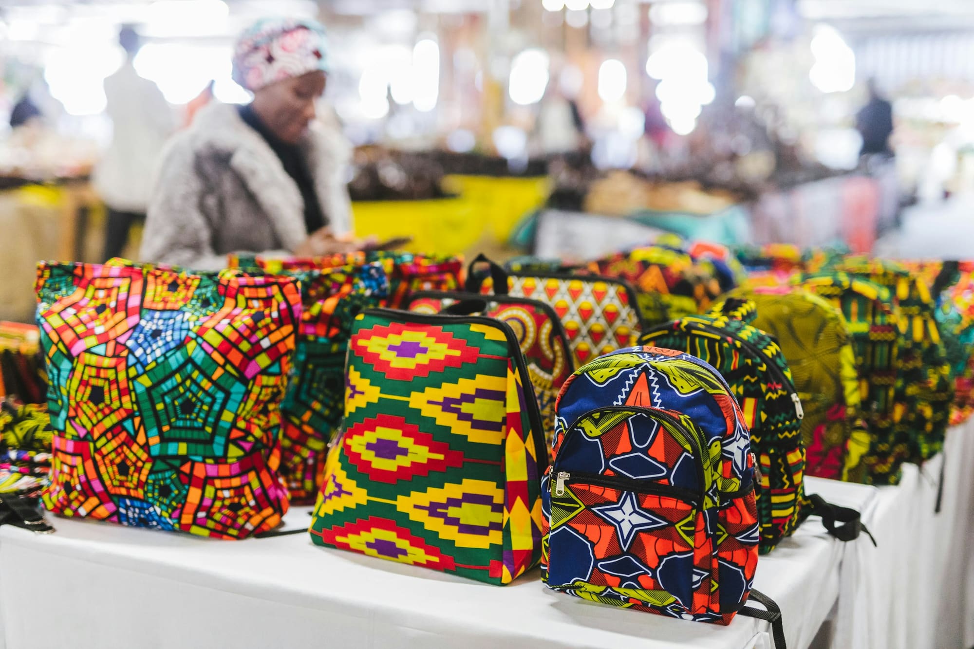 Patterned handmade bags on a market table