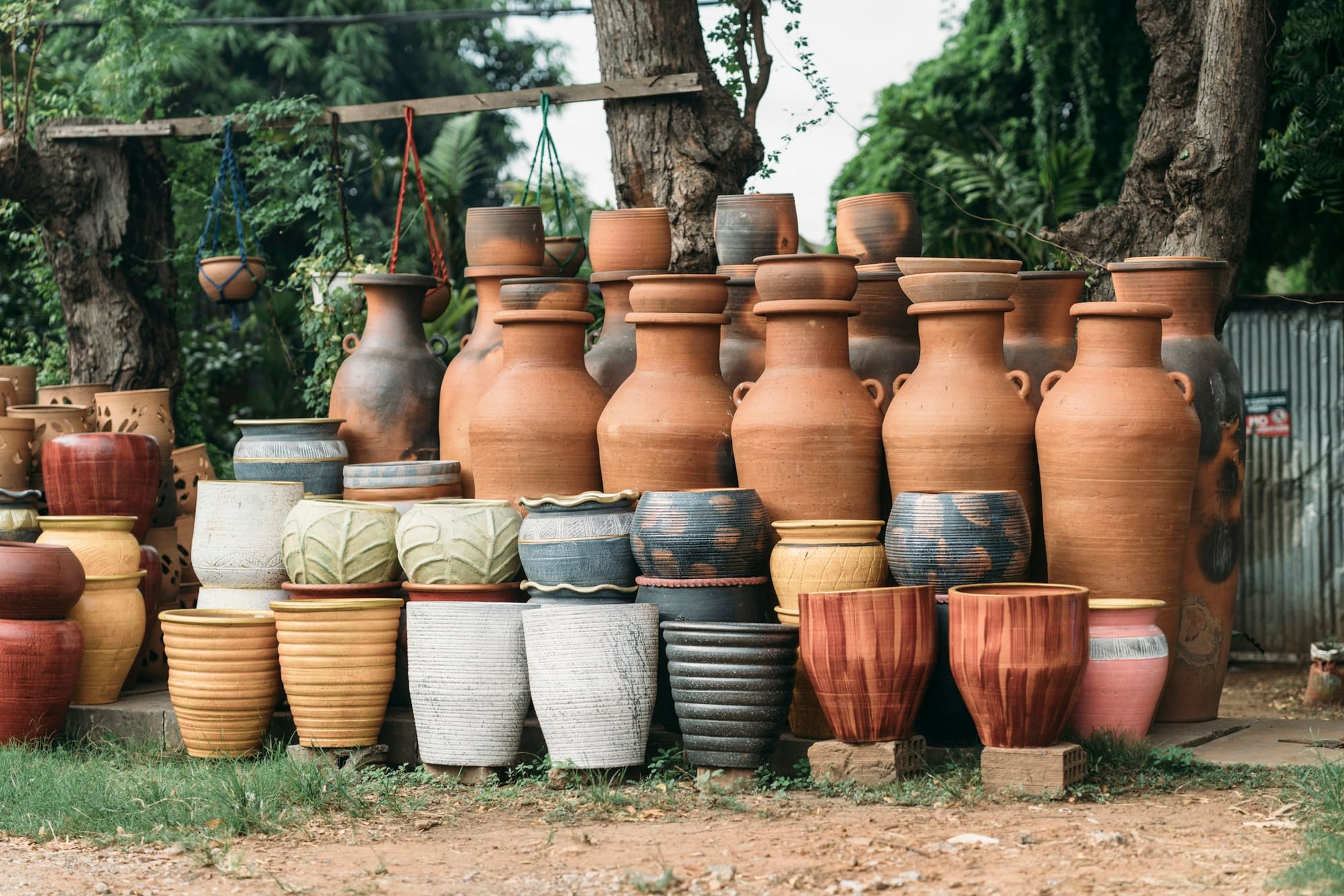 Clay pots of many sizes displayed outdoors