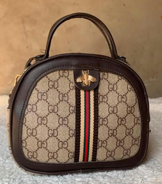 Beige print dome bag with stripe