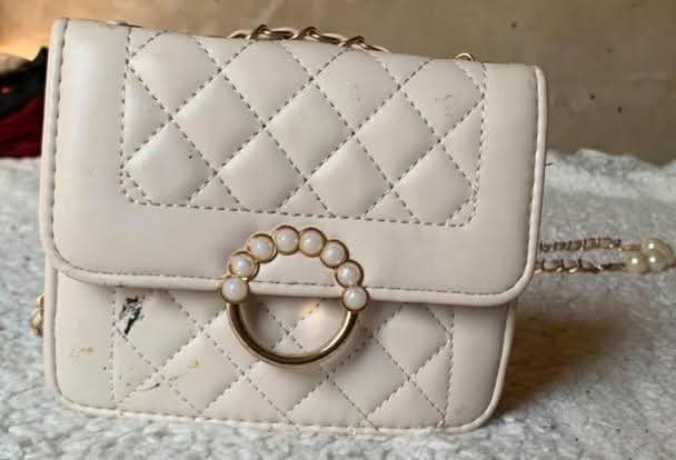 Cream quilted mini bag with pearl ring