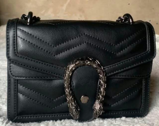 Black chevron-quilted flap bag