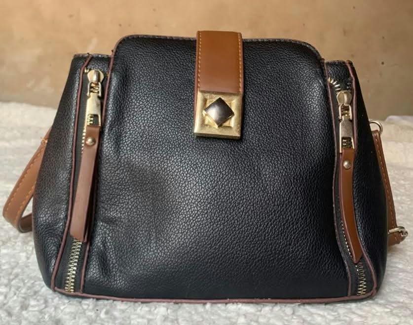 Black and tan zip-side shoulder bag