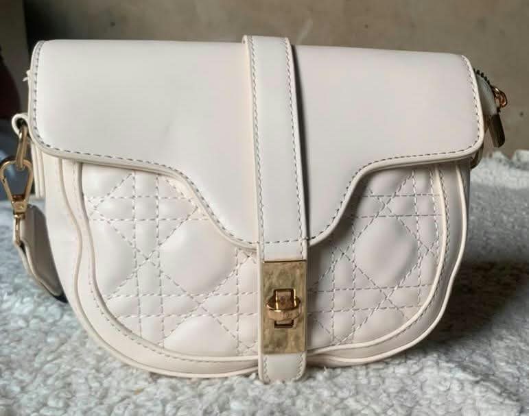 Cream quilted saddle bag
