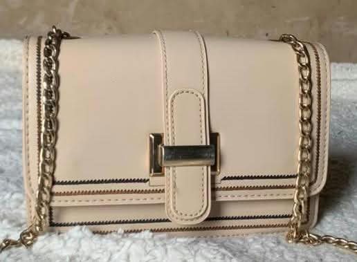 Beige flap crossbody with gold chain